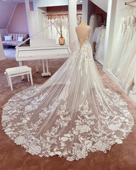 Elegant A-Line V-Neck Sleeveless Floral Lace Wedding Dress with Tulle and Boho Style