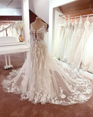 Elegant A-Line V-Neck Sleeveless Floral Lace Wedding Dress with Tulle and Boho Style