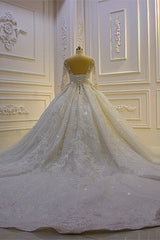 Elegant Long Sleeve Ball Gown Wedding Dress with Beaded Lace Appliques and Church Train