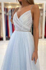 Dazzling Light Blue Tulle Prom Gown: Beaded Spaghetti Straps, Elegant Long Flowing Style