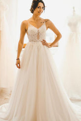 Elegant A-Line Wedding Gown with Spaghetti Straps, Tulle, and Delicate Lace Accents