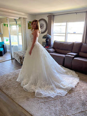 Elegant Off-Shoulder A-Line Lace Wedding Dress with Beaded Appliques