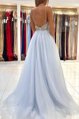 Dazzling Light Blue Tulle Prom Gown: Beaded Spaghetti Straps, Elegant Long Flowing Style