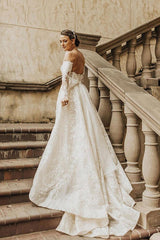Enchanting Off-Shoulder A-Line Wedding Gown with Long Sleeves, Bow, and Lace