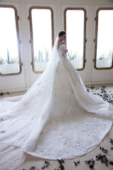 Elegant Off-Shoulder Sweetheart A-Line Wedding Gown with Long Sleeves, Lace, and Crystal Appliques