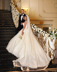 Elegant V-Neck Ball Gown Wedding Dress with Exquisite Lace Appliques