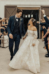 Enchanting Off-Shoulder A-Line Wedding Gown with Long Sleeves, Bow, and Lace