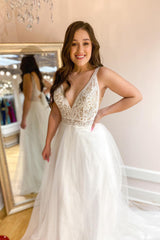 Elegant A-Line Wedding Dress: Deep V-Neck, Spaghetti Straps & Tulle Train