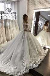Elegant Off-Shoulder Long Sleeve Illusion Ball Gown Wedding Dress with Appliques
