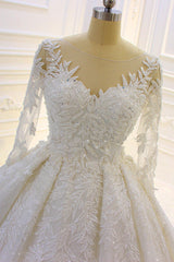 Elegant Long Sleeve Ball Gown Wedding Dress with Beaded Lace Appliques and Church Train