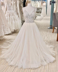 Elegant Backless A-Line Wedding Dress with Pearl V-Neck