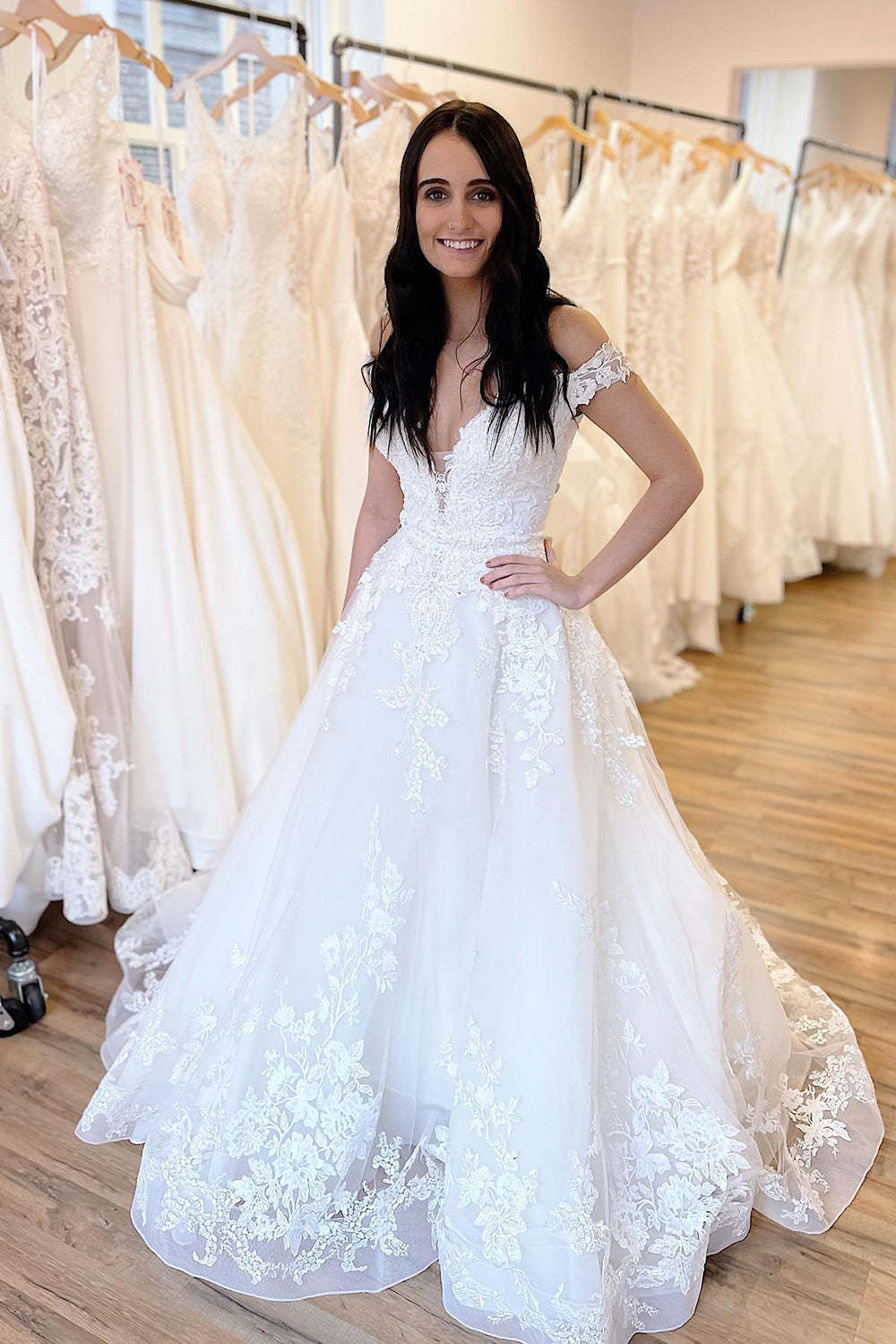 Elegant Off-Shoulder Sweetheart A-Line Wedding Gown with Delicate Lace Appliques and Train