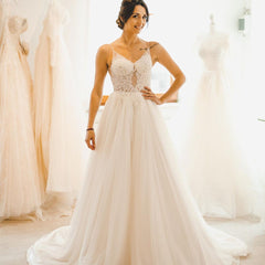 Elegant A-Line Wedding Gown with Spaghetti Straps, Tulle, and Delicate Lace Accents