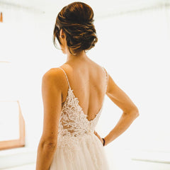 Elegant A-Line Wedding Gown with Spaghetti Straps, Tulle, and Delicate Lace Accents