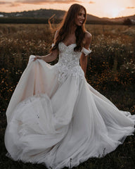 Elegant Off-Shoulder A-Line Tulle Wedding Dress with Delicate Lace Appliques