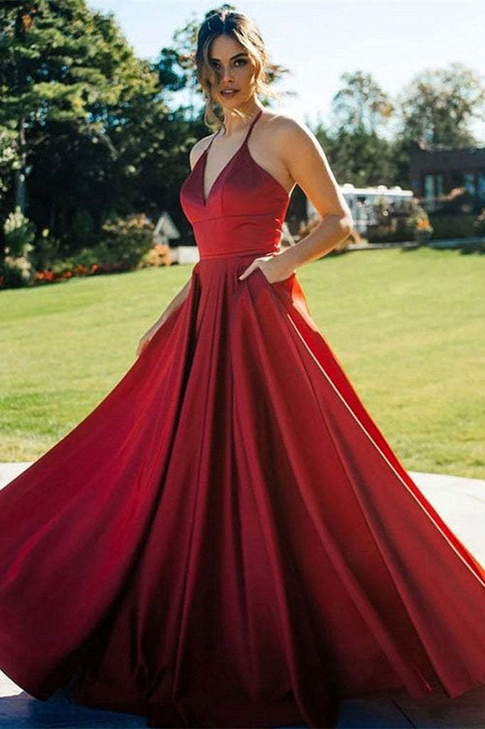 Elegant Red V-Neck Evening Gown with Pockets and Flowing Skirt