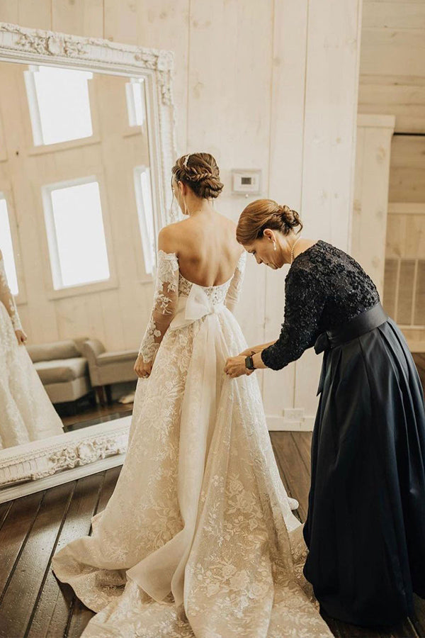 Enchanting Off-Shoulder A-Line Wedding Gown with Long Sleeves, Bow, and Lace