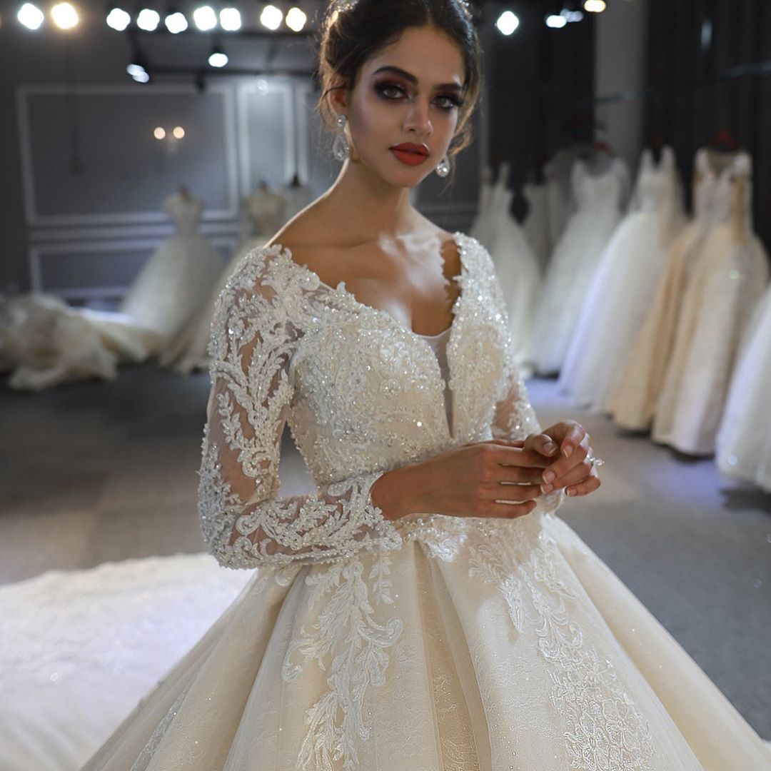 Elegant A-Line Sweetheart Wedding Dress with Long Sleeves, Lace Appliques & Sequins