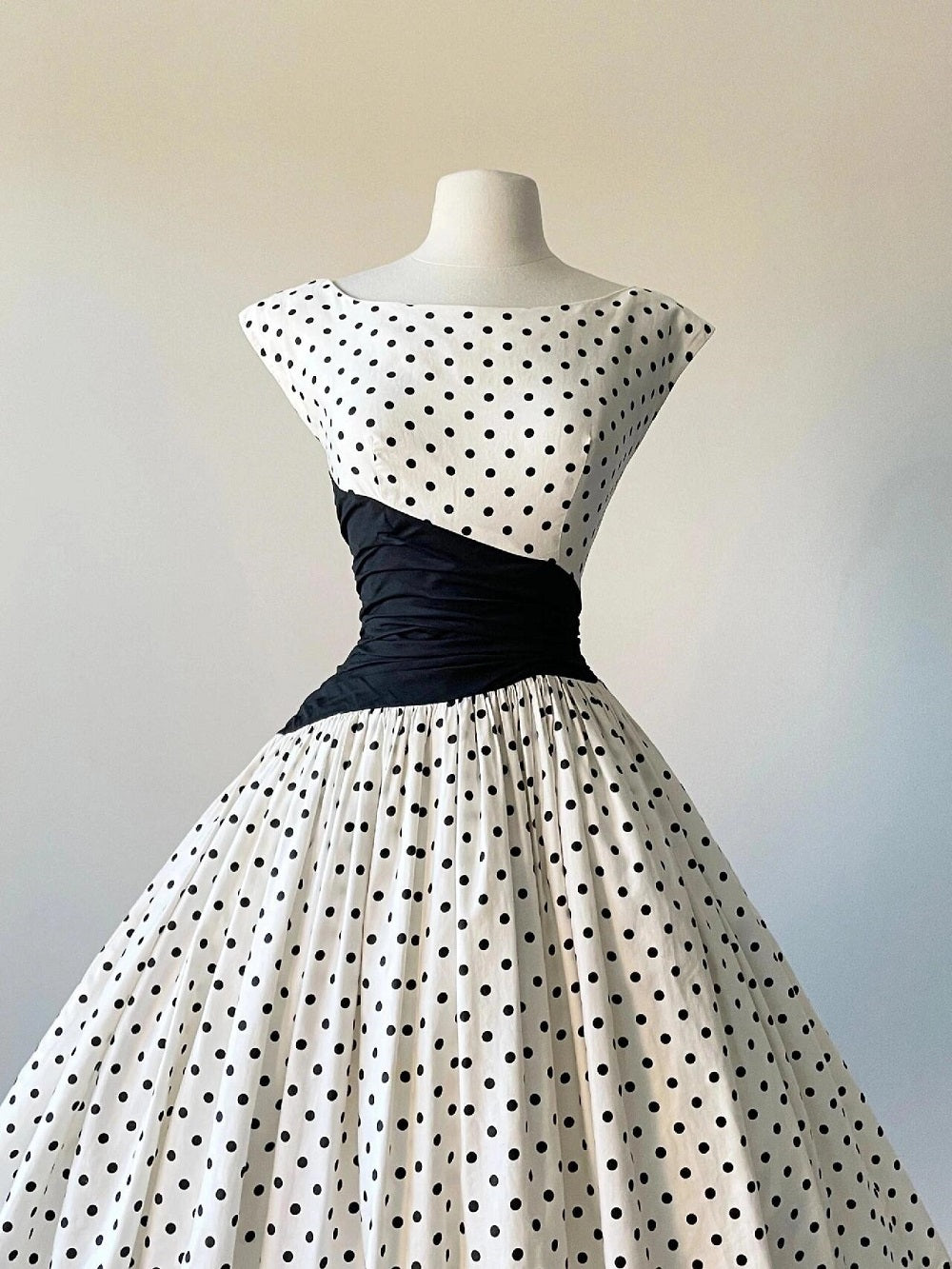 Cap Sleeve Vintage 50s Polka Dot Swing Dress with Black Asymmetrical Waist Panel