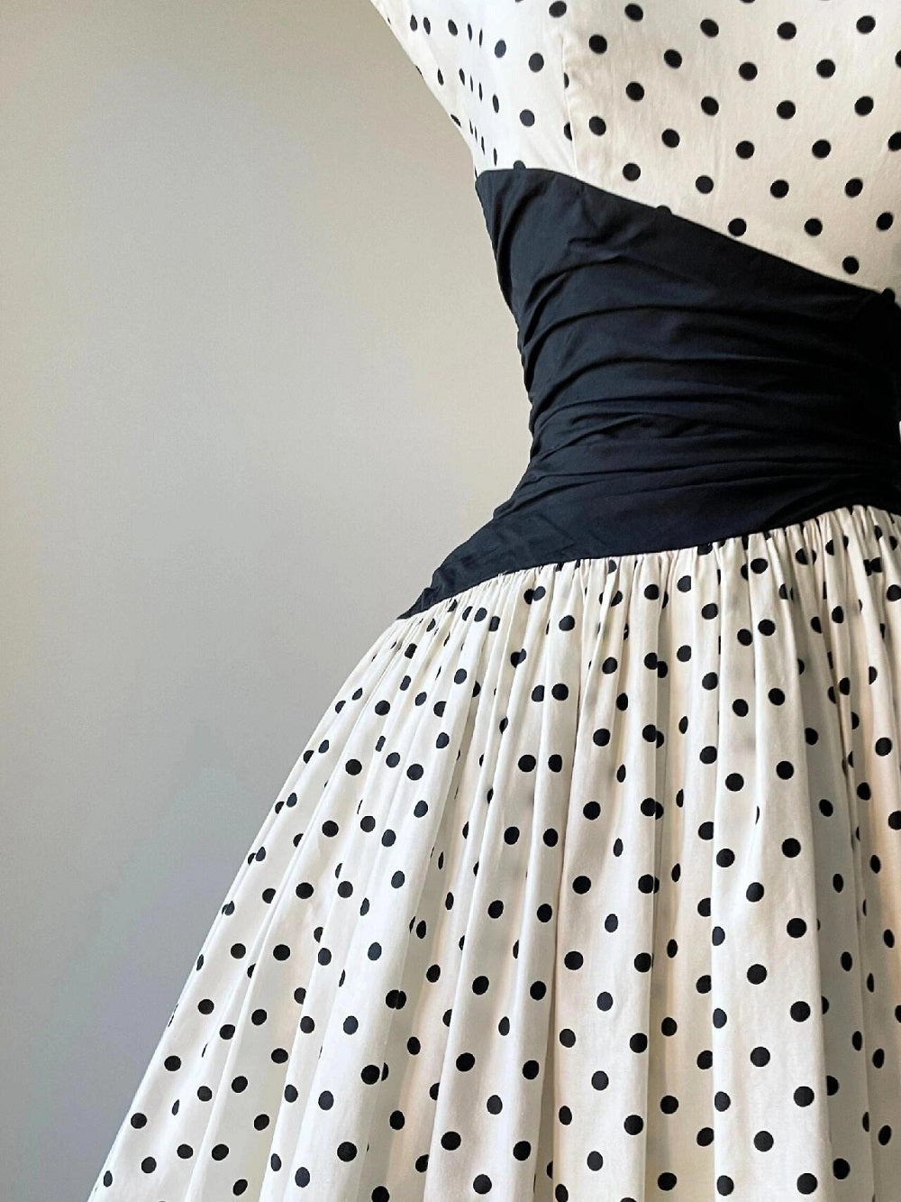 Cap Sleeve Vintage 50s Polka Dot Swing Dress with Black Asymmetrical Waist Panel Cap Sleeve Vintage 50s Polka Dot Swing Dress with Black Asymmetrical Waist Panel