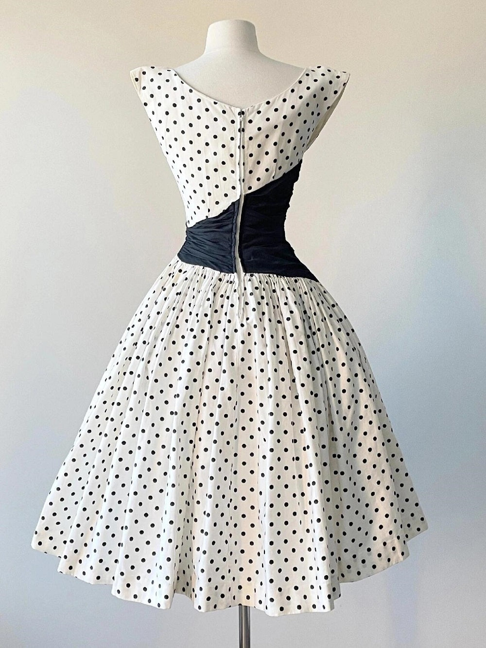 Cap Sleeve Vintage 50s Polka Dot Swing Dress with Black Asymmetrical Waist Panel Cap Sleeve Vintage 50s Polka Dot Swing Dress with Black Asymmetrical Waist Panel