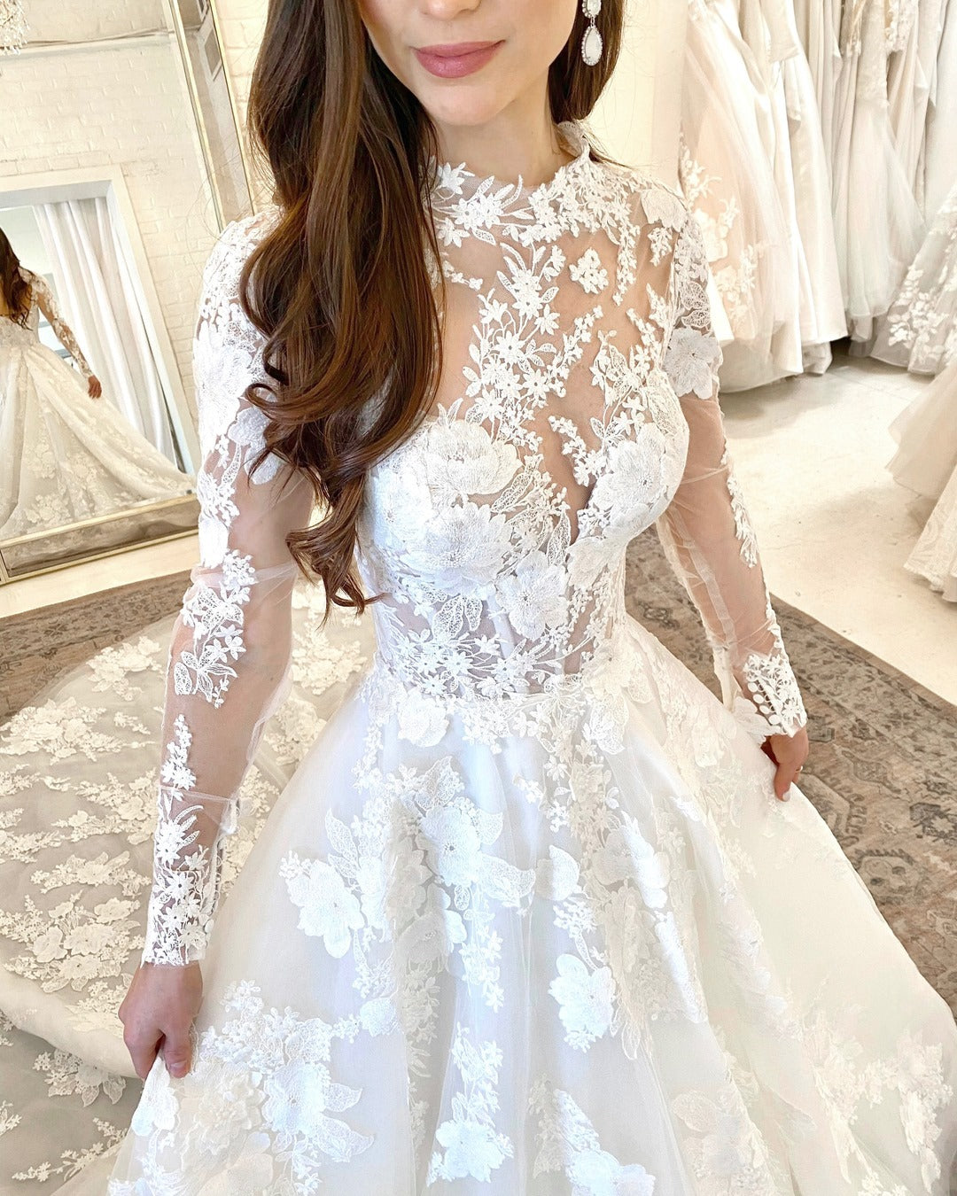 Elegant High-Neck A-Line Wedding Gown with Lace Sleeves and Open Back Design