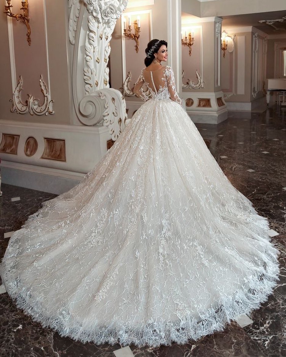Elegant Bateau Long Sleeve Beaded A-Line Lace Wedding Gown with Chapel Train