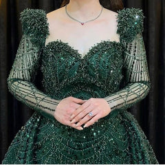 Elegant Green Applique Prom Dress: Long Sleeve Mermaid Gown with Exquisite Details