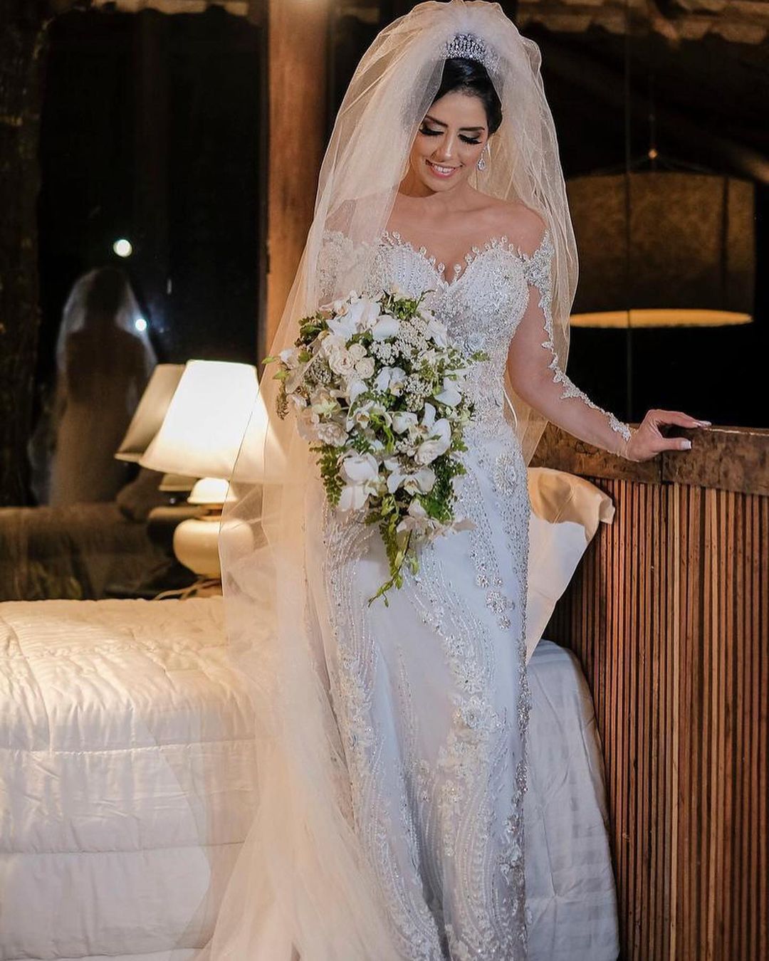 Elegant Off-Shoulder Long Sleeve Mermaid Wedding Gown with Exquisite Lace Appliques